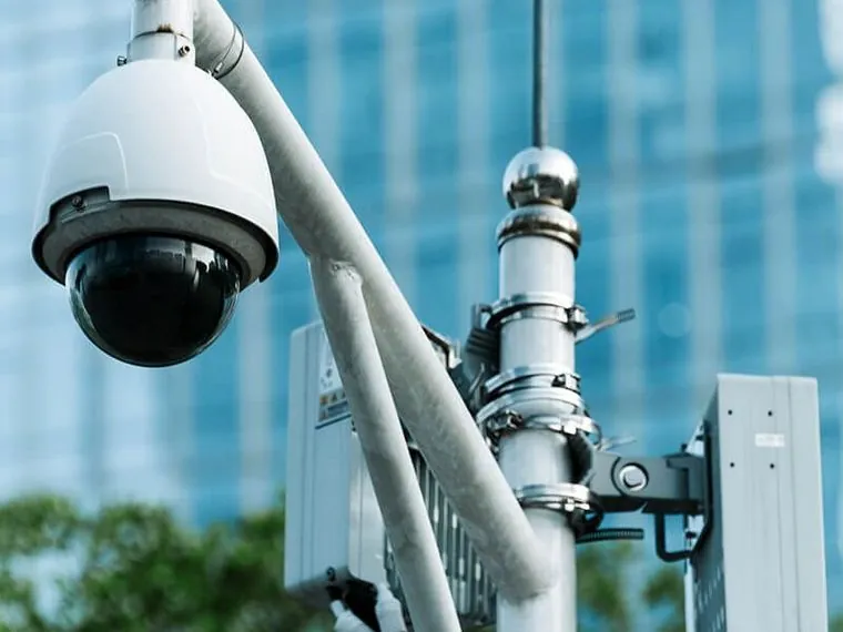 Dome CCTV camera installed on a pole outside a commercial building in Dubai